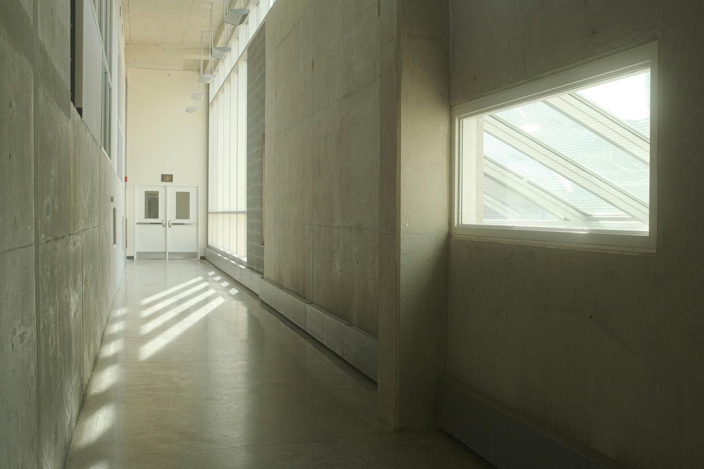 A sunlit institutional corridor