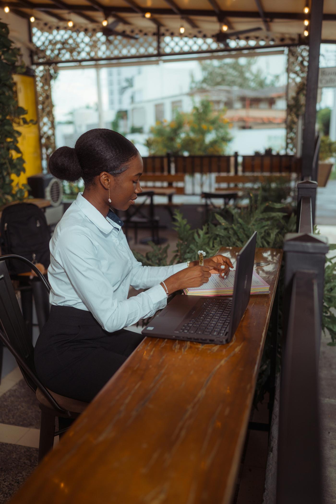 Writing at a café table
